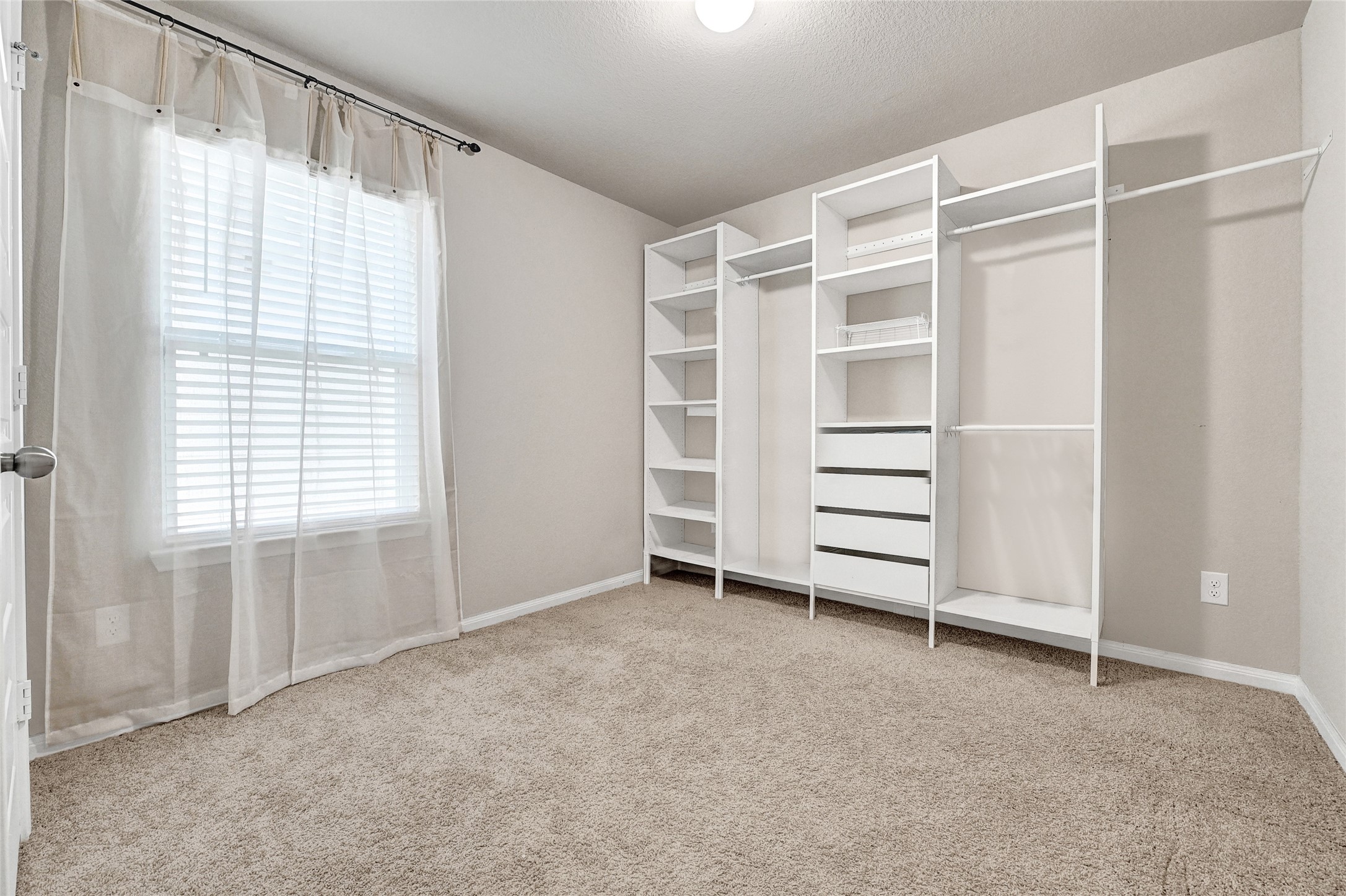 1329 Mount Blanc Path Conroe, TX 77301 - Photo 17 of 23 a view of an empty room with a window