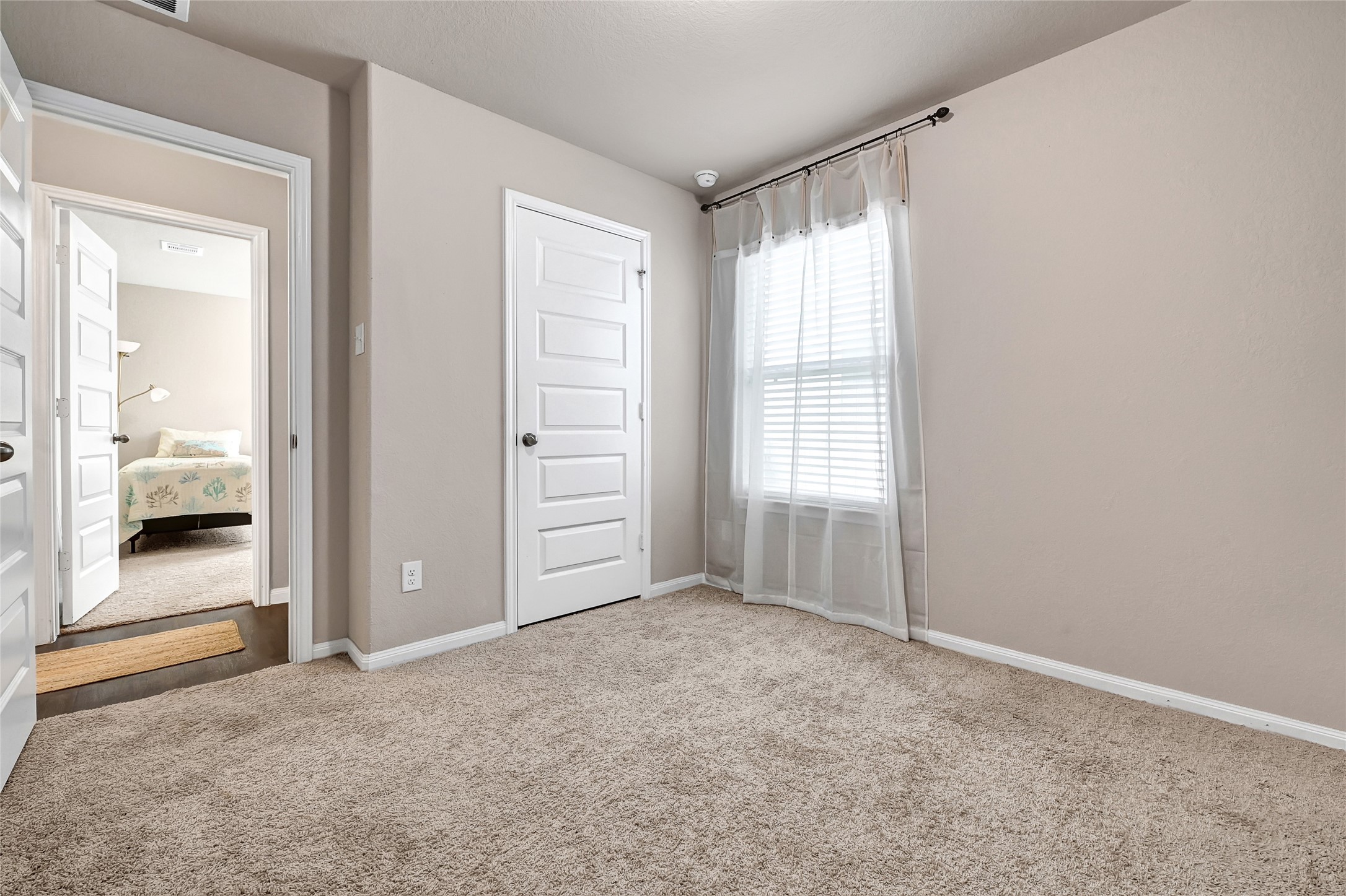 1329 Mount Blanc Path Conroe, TX 77301 - Photo 18 of 23 an empty room with windows and closet