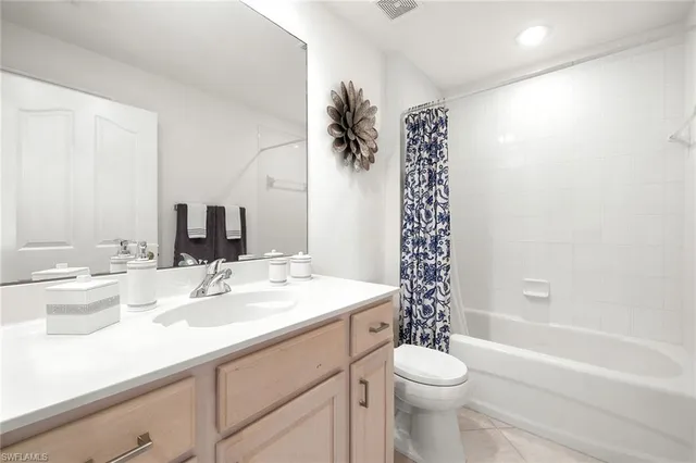 a bathroom with a sink a toilet and a bathtub