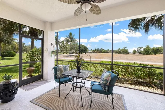 a view of a porch with furniture and garden