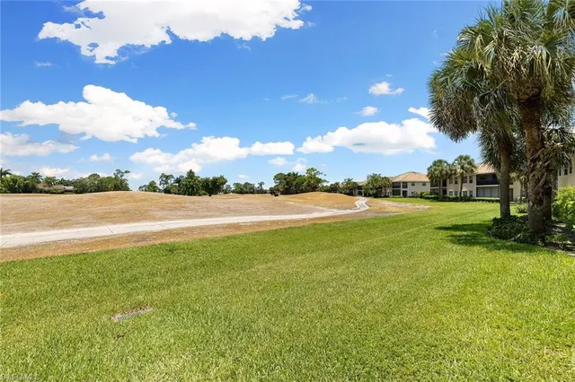 a view of a lake with a big yard