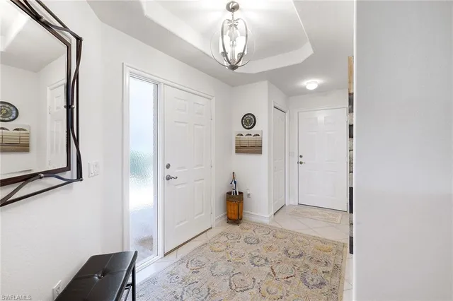 a view of a hallway to rooms and wooden floor