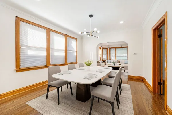 a view of a dining room with furniture window and wooden floor