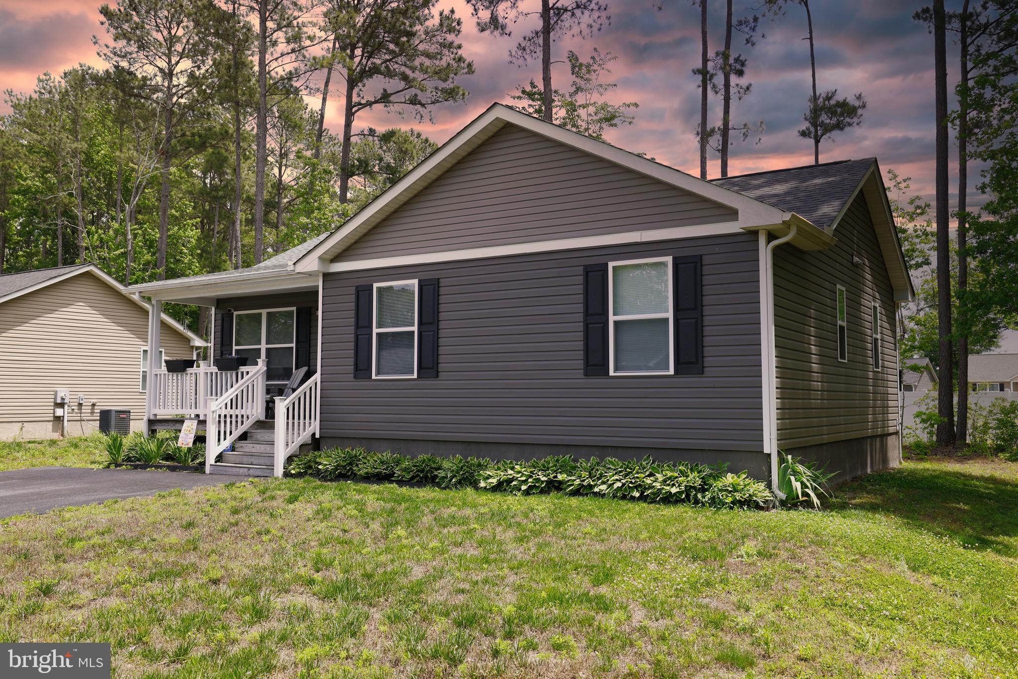48 Rustic Lane Colonial Beach, VA 22443 - Photo 2 of 47 a front view of a house with garden