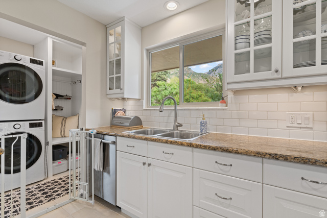 3320 Cherokee Lane Provo, UT 84604 - Photo 14 of 52 Kitchen area featuring white cabinetry with glass-front uppers, a subway tile backsplash, and a double-basin stainless steel sink