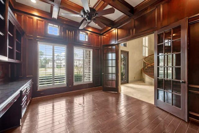 a view of an entryway with wooden floor
