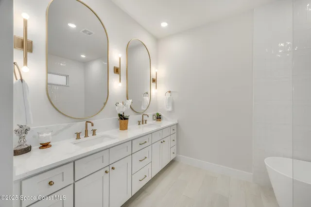 a bathroom with a sink and mirror