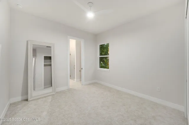 a view of a house with backyard and garden