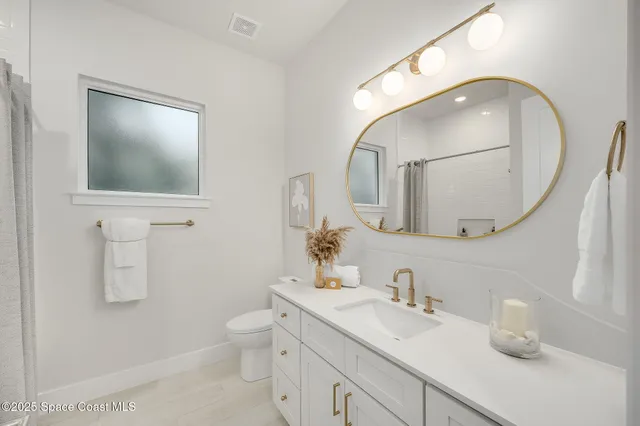 an aerial view of a house with a swimming pool