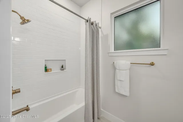 an aerial view of a house with a lake view