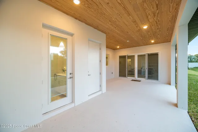an aerial view of a house with a lake view