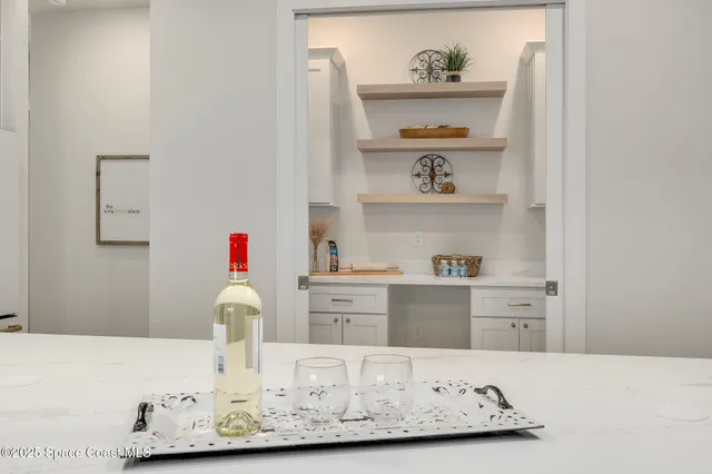 a kitchen with a sink a stove and cabinets