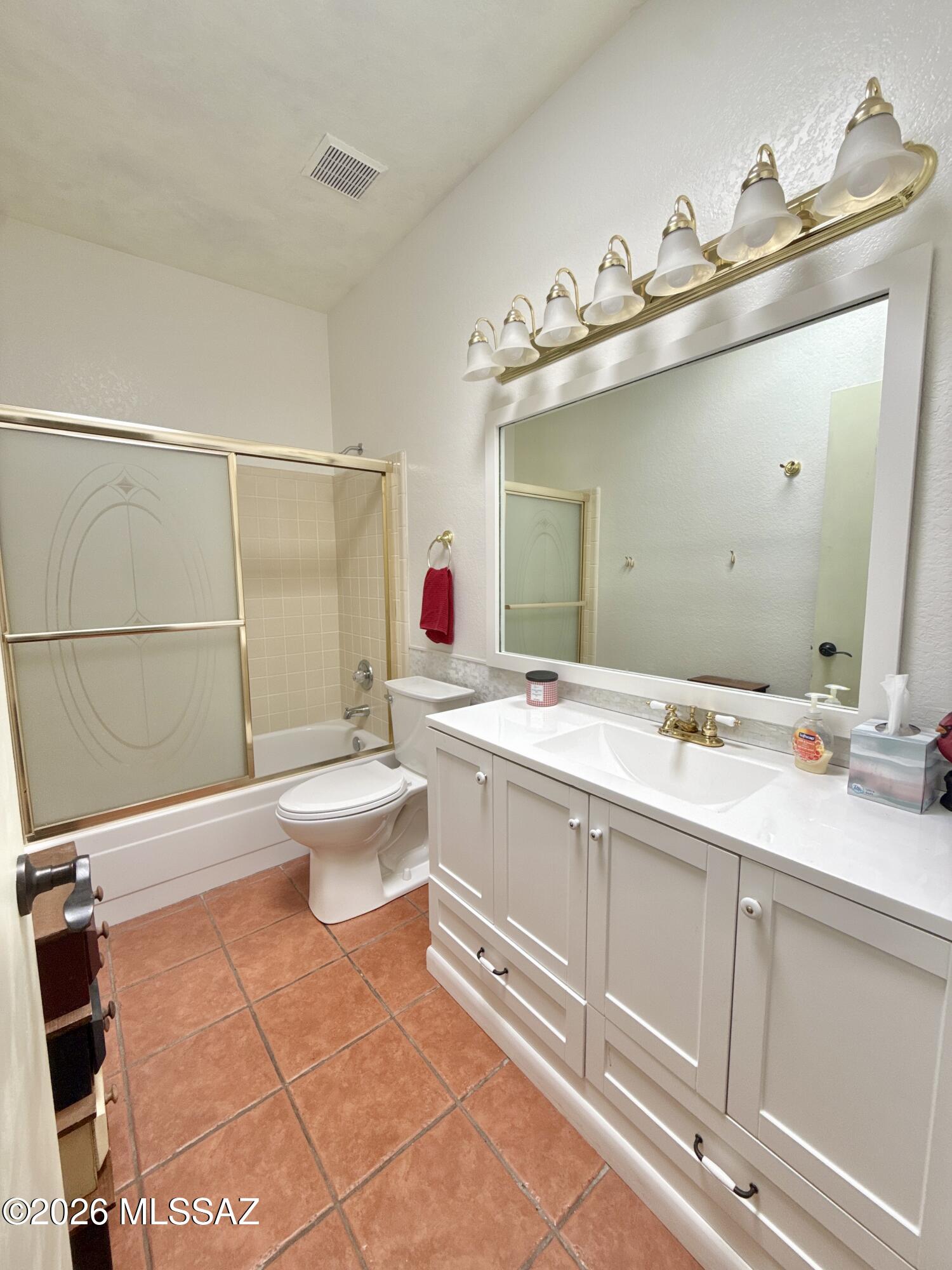 8110 East Rivenoak Circle Tucson, AZ 85715 - Photo 18 of 29 a bathroom with a double vanity sink mirror and toilet
