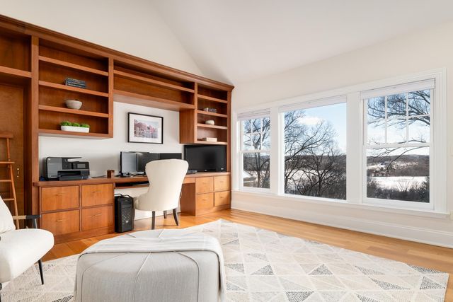 a bedroom with a bed and glass window
