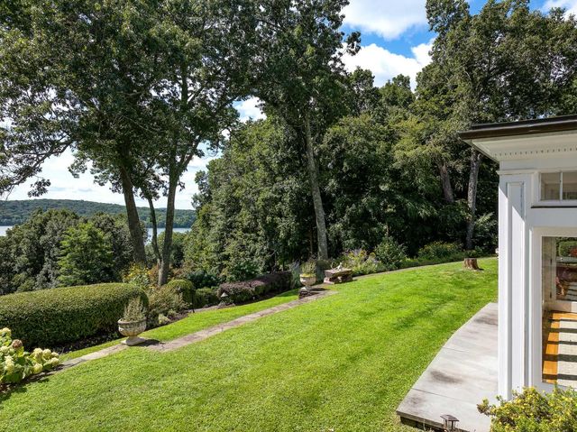 a view of a backyard with large trees