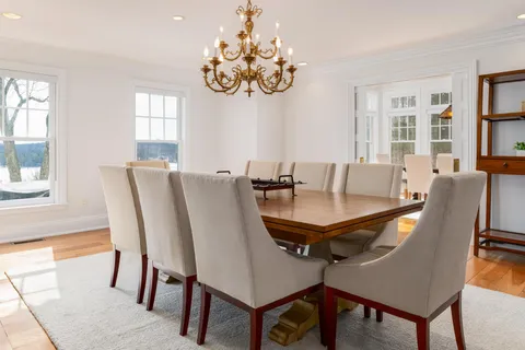 a view of a dining room with furniture and window