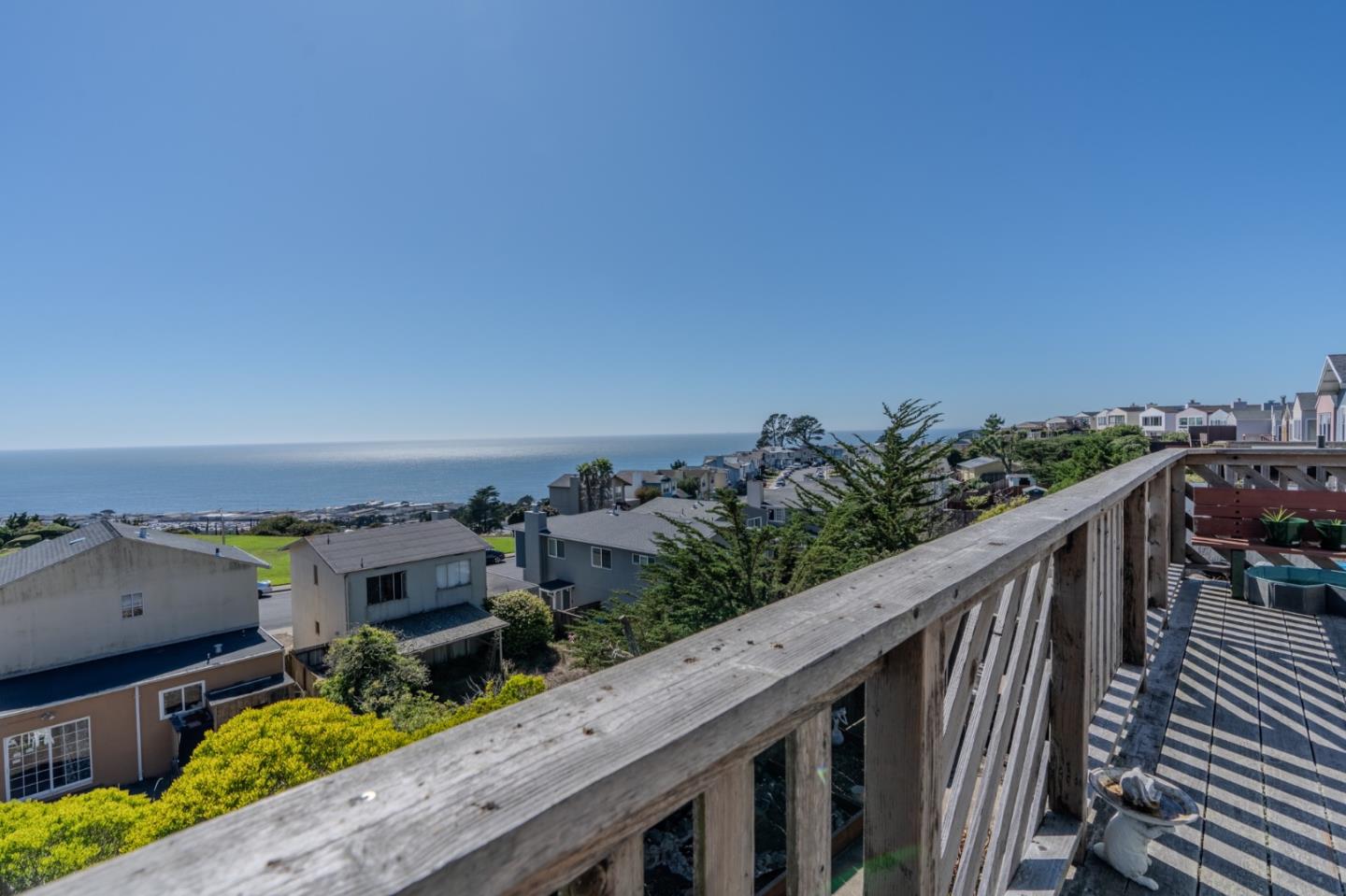 226 Crestmoor Circle Pacifica, CA 94044 - Photo 17 of 23 a balcony with wooden floor and city view