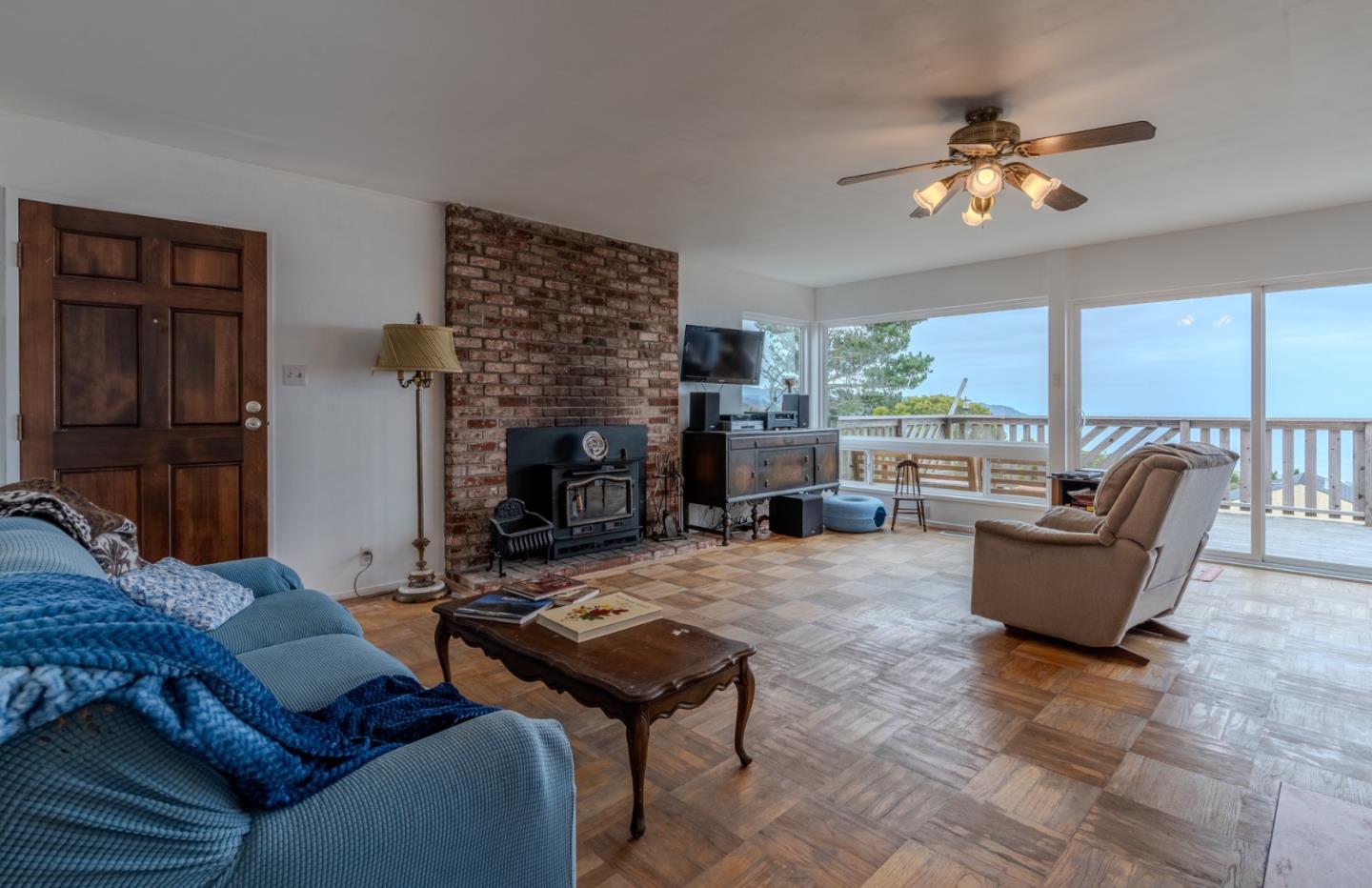 226 Crestmoor Circle Pacifica, CA 94044 - Photo 3 of 23 a living room with furniture and a fireplace