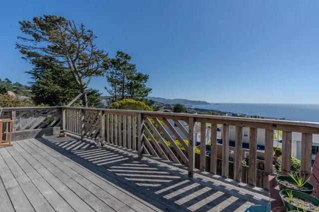 a view of wooden balcony with outdoor space
