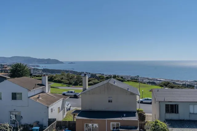 an aerial view of residential houses and outdoor space