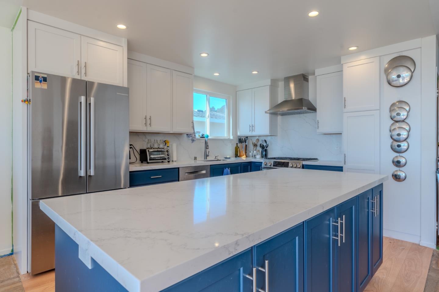 226 Crestmoor Circle Pacifica, CA 94044 - Photo 8 of 23 a kitchen with stainless steel appliances granite countertop a sink a stove a refrigerator and a refrigerator