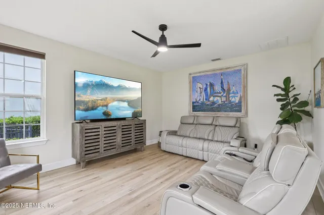 a living room with furniture and a window