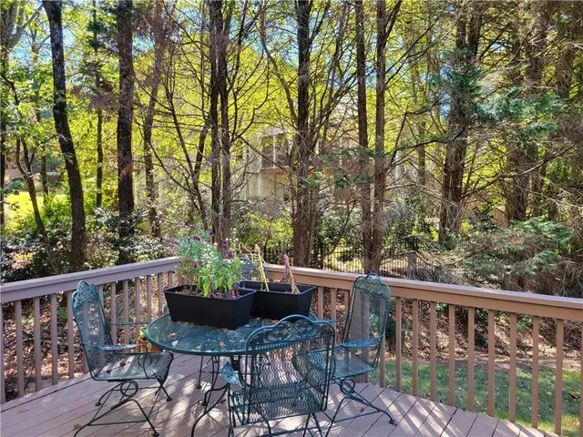 a view of a backyard with a tree