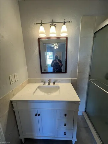 a bathroom with a sink and a mirror