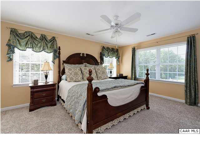 3771 Ashleigh Way Road Barboursville, VA 22923 - Photo 17 of 26 The master bedroom is adorned with beautiful windows offering views of the majestic Blue Ridge Mountains.