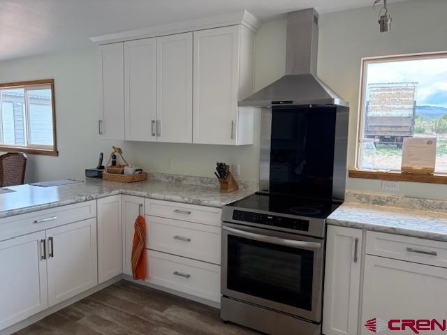 15736 2600th Road Cedaredge, CO 81413 - Photo 18 of 43 a kitchen with granite countertop white cabinets and black appliances