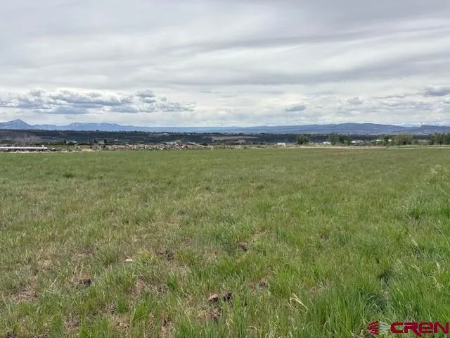 a view of an ocean and sunset
