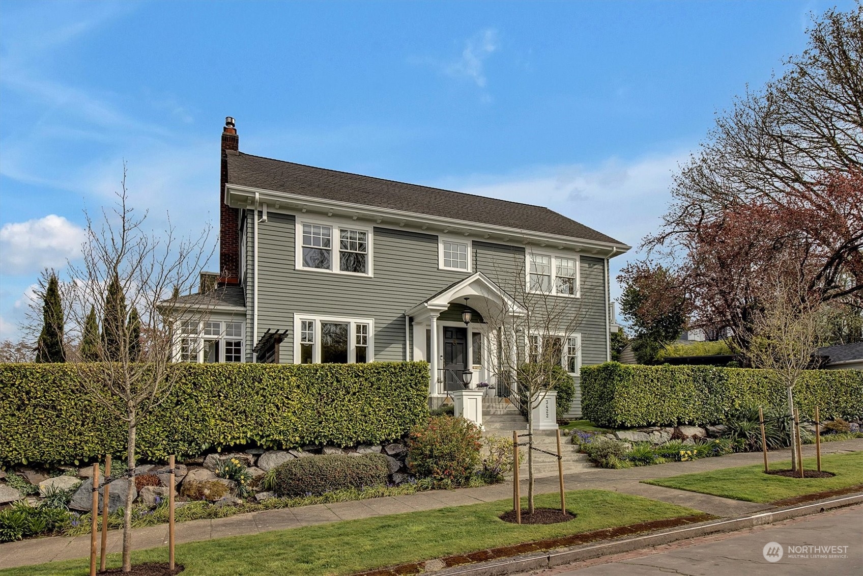 a front view of a house with a yard