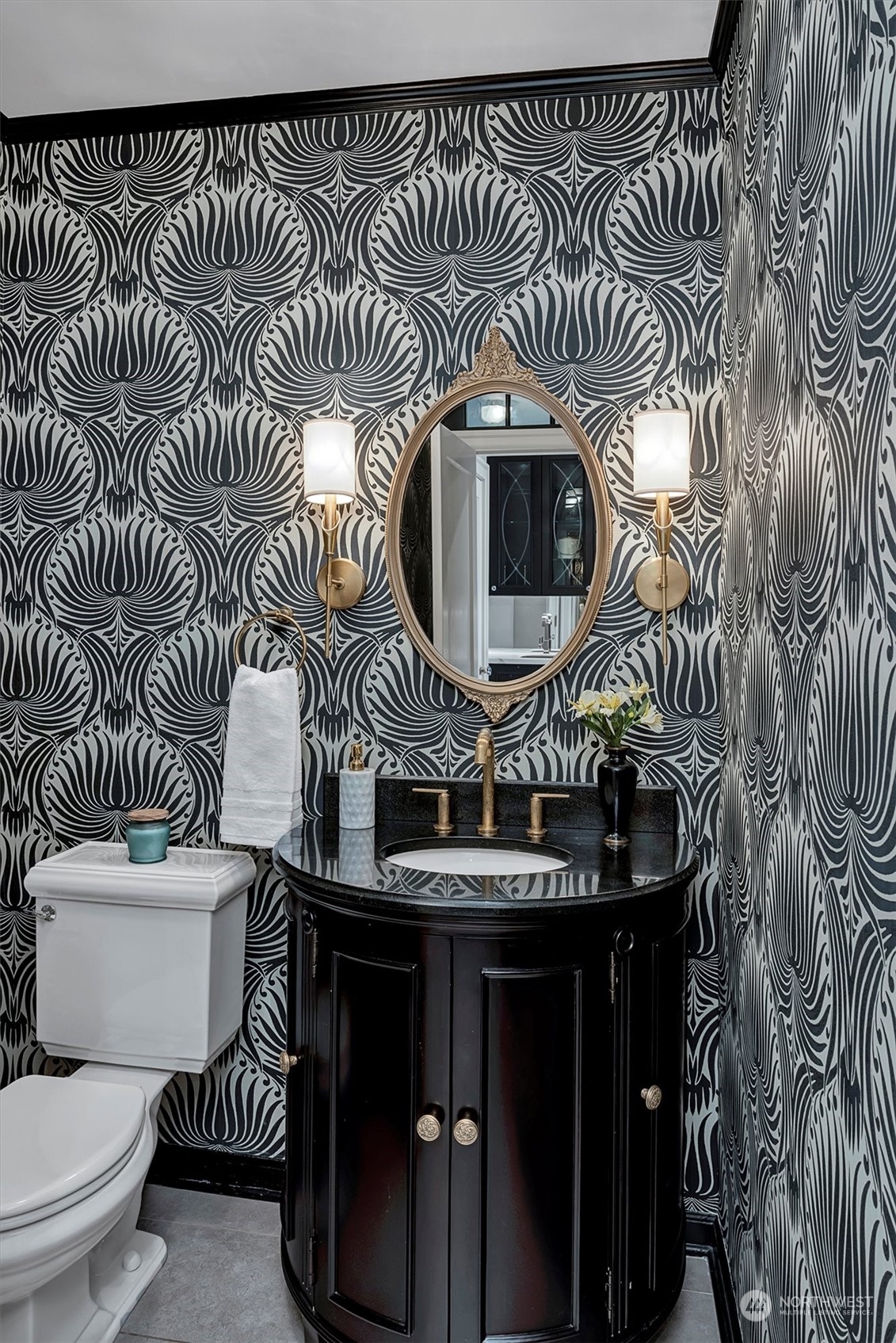 3422 Hunter Boulevard South Seattle, WA 98144 - Photo 18 of 40 a bathroom with a toilet a sink and mirror