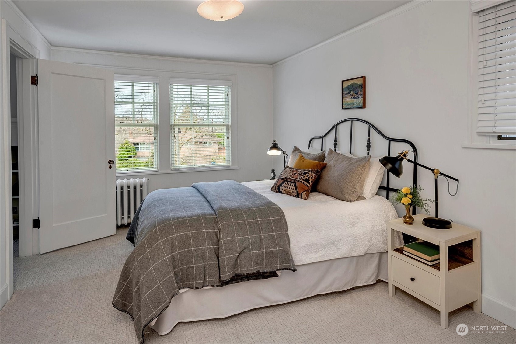 3422 Hunter Boulevard South Seattle, WA 98144 - Photo 21 of 40 a bedroom with a bed and a window