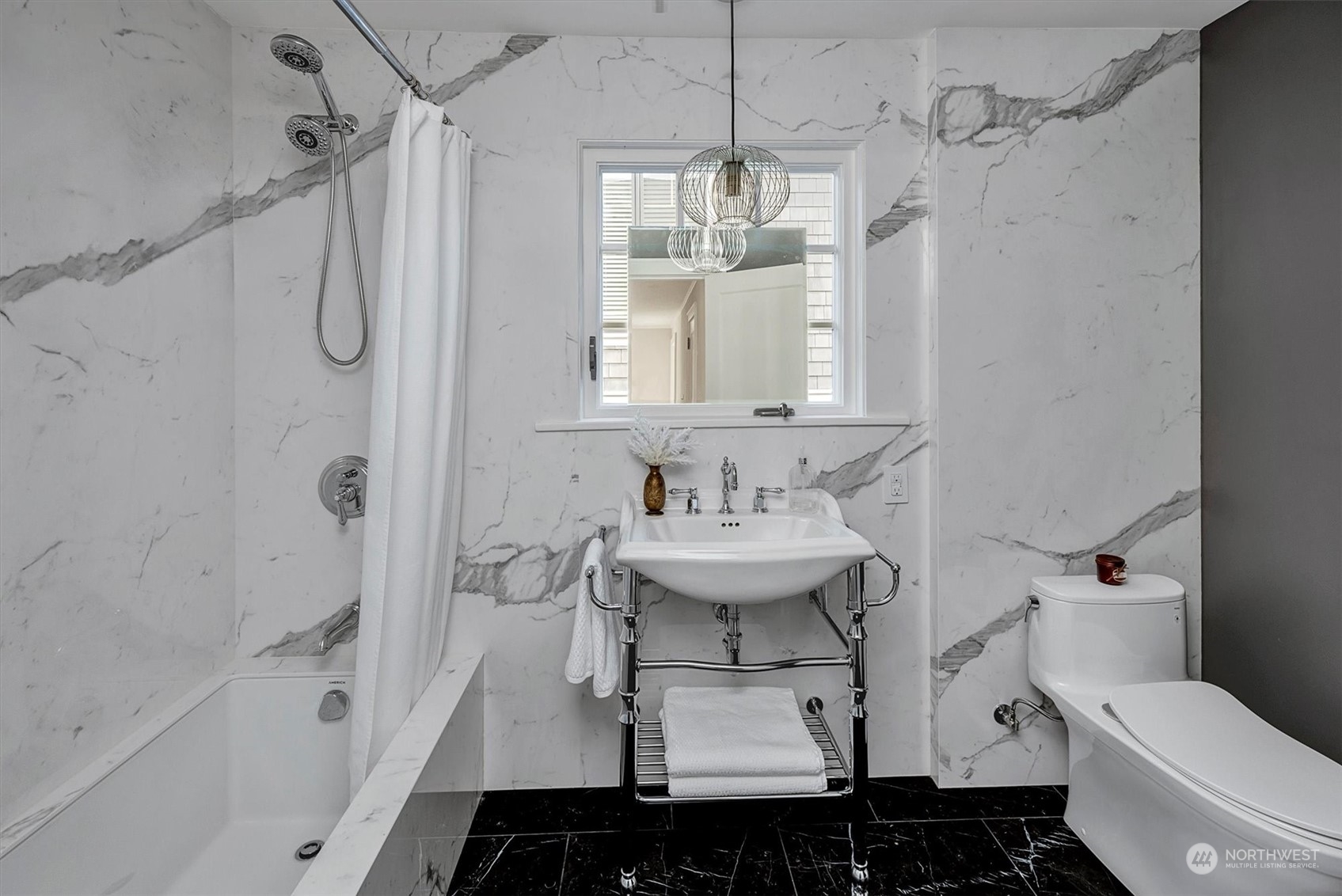3422 Hunter Boulevard South Seattle, WA 98144 - Photo 22 of 40 a bathroom with a sink toilet and shower