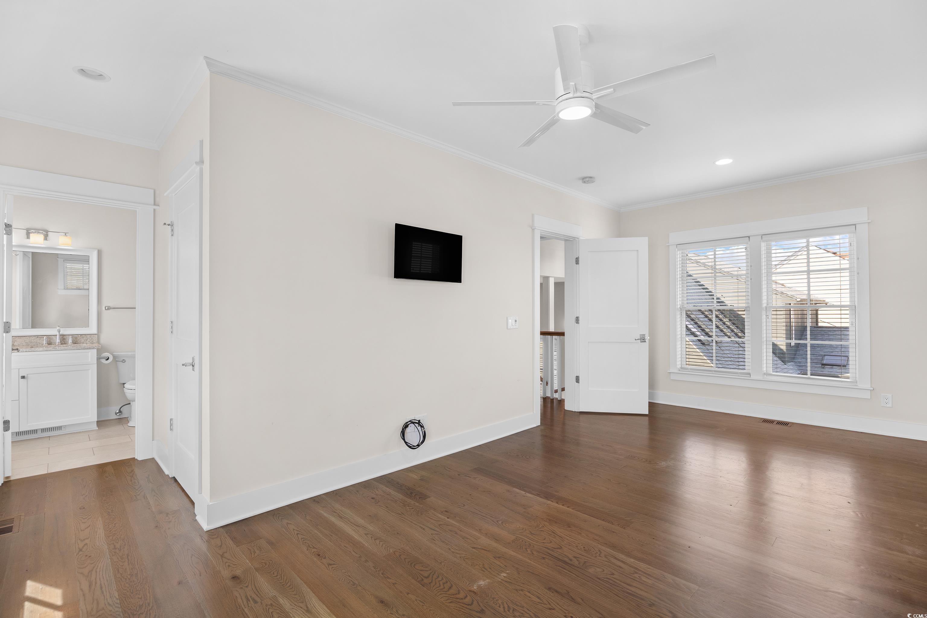 40 Seaview Loop Pawleys Island, SC 29585 - Photo 14 of 34 Unfurnished living room with crown molding, dark wood-style flooring, ceiling fan, and recessed lighting