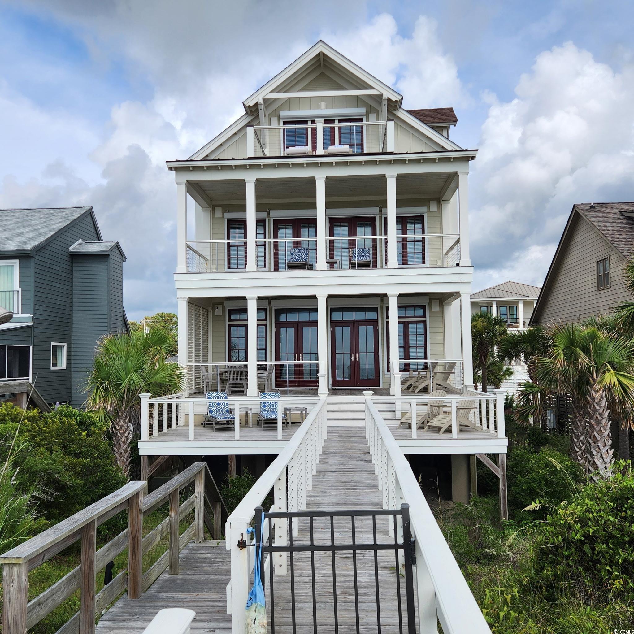 40 Seaview Loop Pawleys Island, SC 29585 - Photo 4 of 34 Rear view of property featuring french doors and board and batten siding