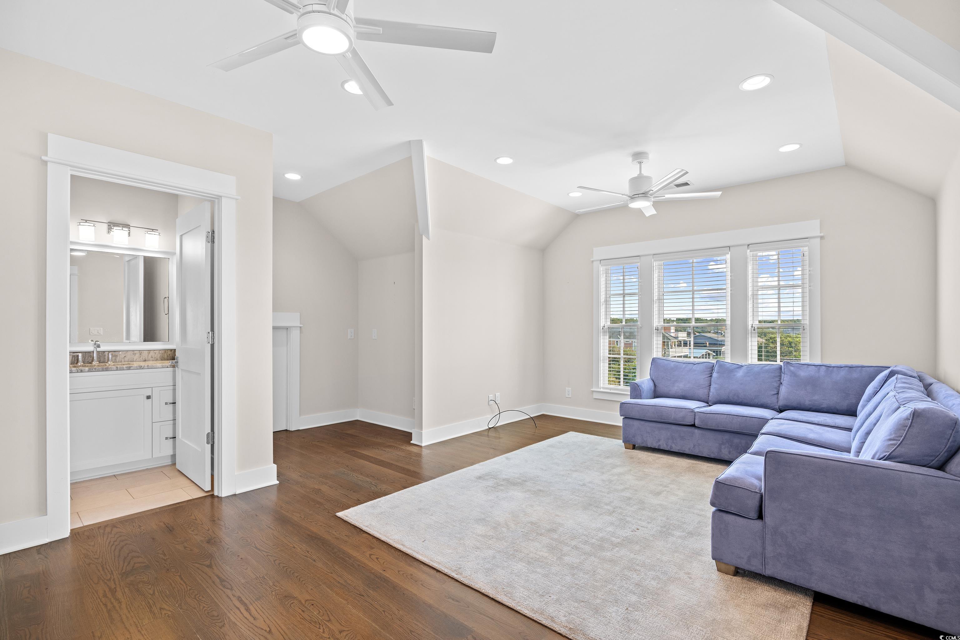 40 Seaview Loop Pawleys Island, SC 29585 - Photo 9 of 34 Living room with dark wood-type flooring, vaulted ceiling, ceiling fan, and recessed lighting