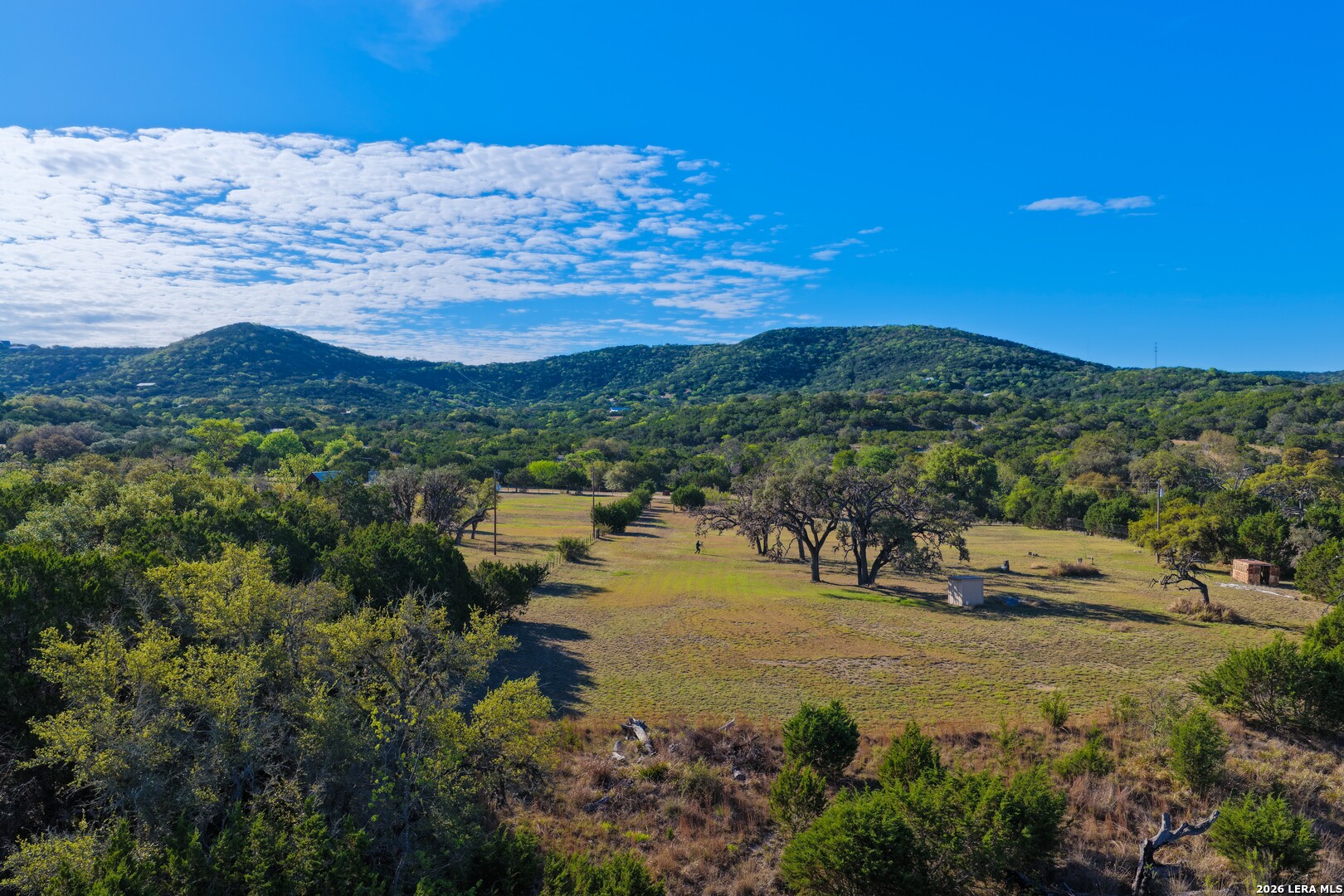 348 Rocky Road Pipe Creek, TX 78063 - Photo 9 of 41 a view of lake with mountain