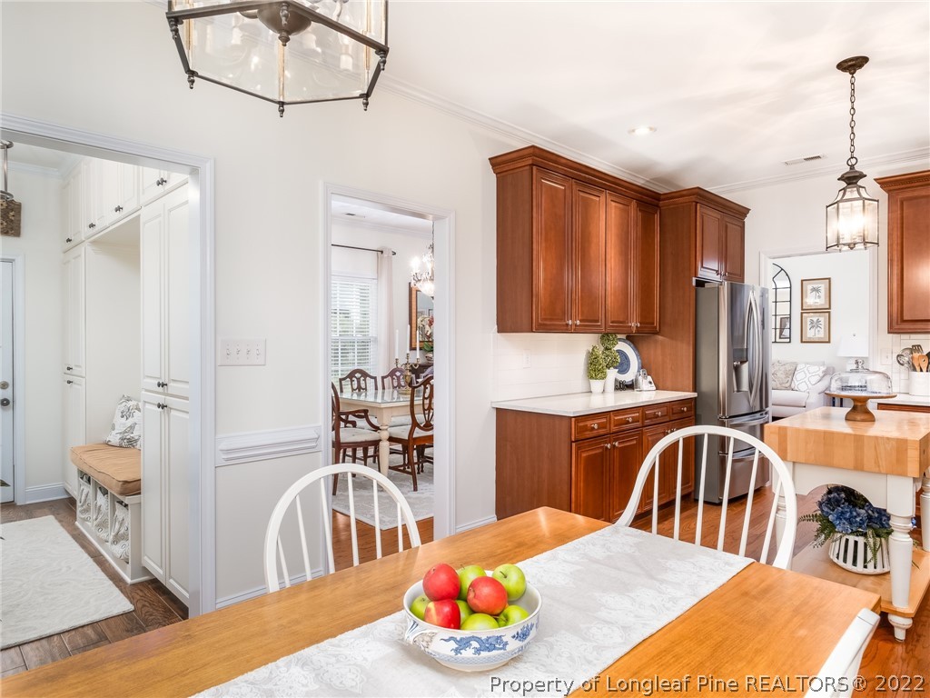 320 Porlock Way Raeford, NC 28376 - Photo 12 of 41 a bedroom with a bed and a chandelier