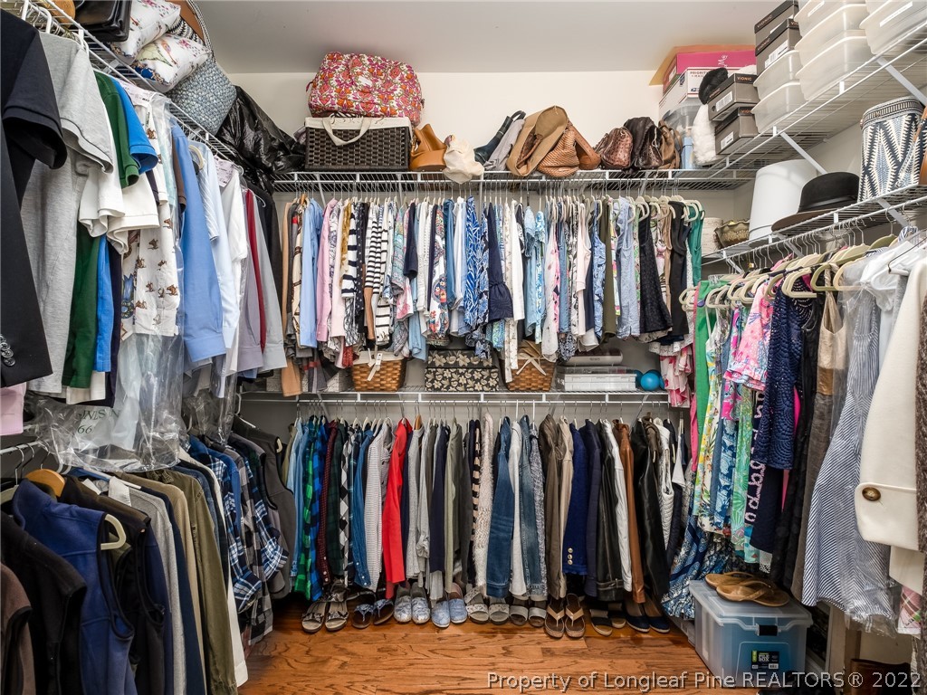 320 Porlock Way Raeford, NC 28376 - Photo 22 of 41 a view of walk in closet with clothes