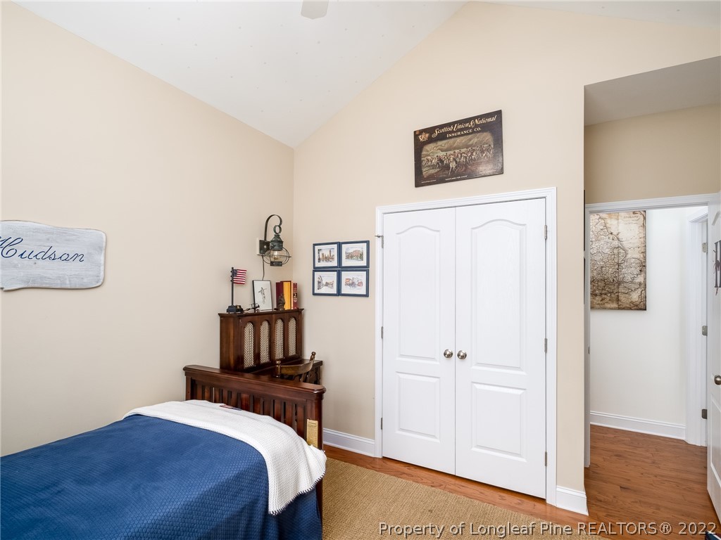 320 Porlock Way Raeford, NC 28376 - Photo 29 of 41 a bedroom with a bed and a table