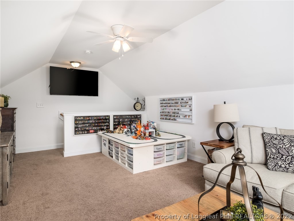 320 Porlock Way Raeford, NC 28376 - Photo 31 of 41 a living room with furniture and a flat screen tv