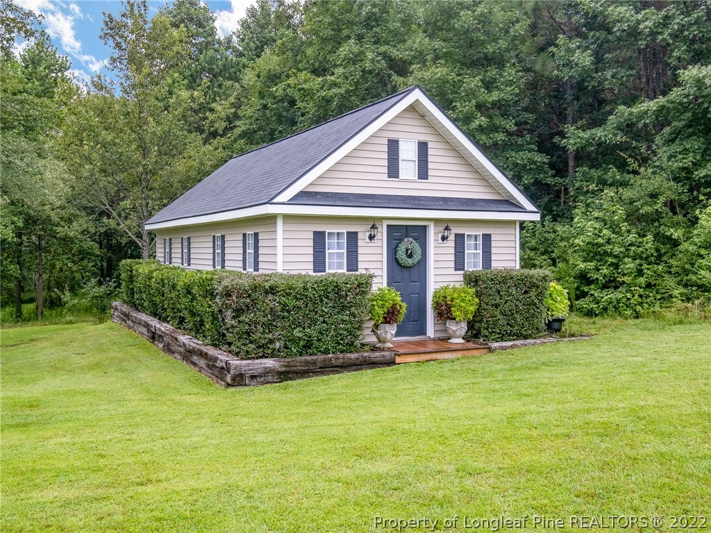 320 Porlock Way Raeford, NC 28376 - Photo 32 of 41 a front view of a house with a yard