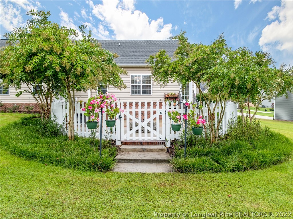 320 Porlock Way Raeford, NC 28376 - Photo 38 of 41 a front view of a house with a garden