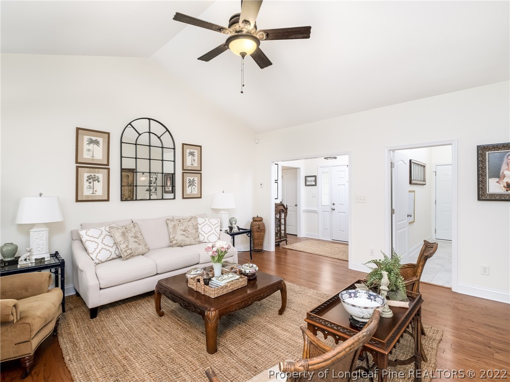 320 Porlock Way Raeford, NC 28376 - Photo 9 of 41 a living room with furniture or couch and a chandelier