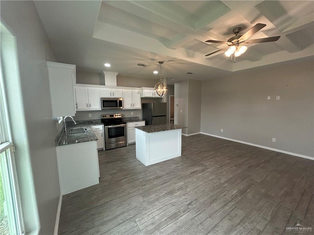 1805 Stauffers Street, Unit 1 Weslaco, TX 78596 - Photo 13 of 13 a kitchen with a refrigerator and a microwave
