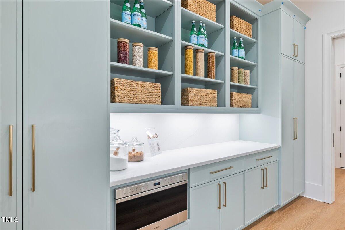 222 Reynolds Road Raleigh, NC 27609 - Photo 15 of 43 a view of cabinets and window