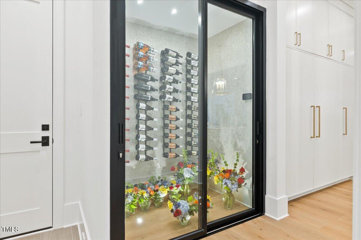 222 Reynolds Road Raleigh, NC 27609 - Photo 16 of 43 view of a hallway with wooden floor and dining room