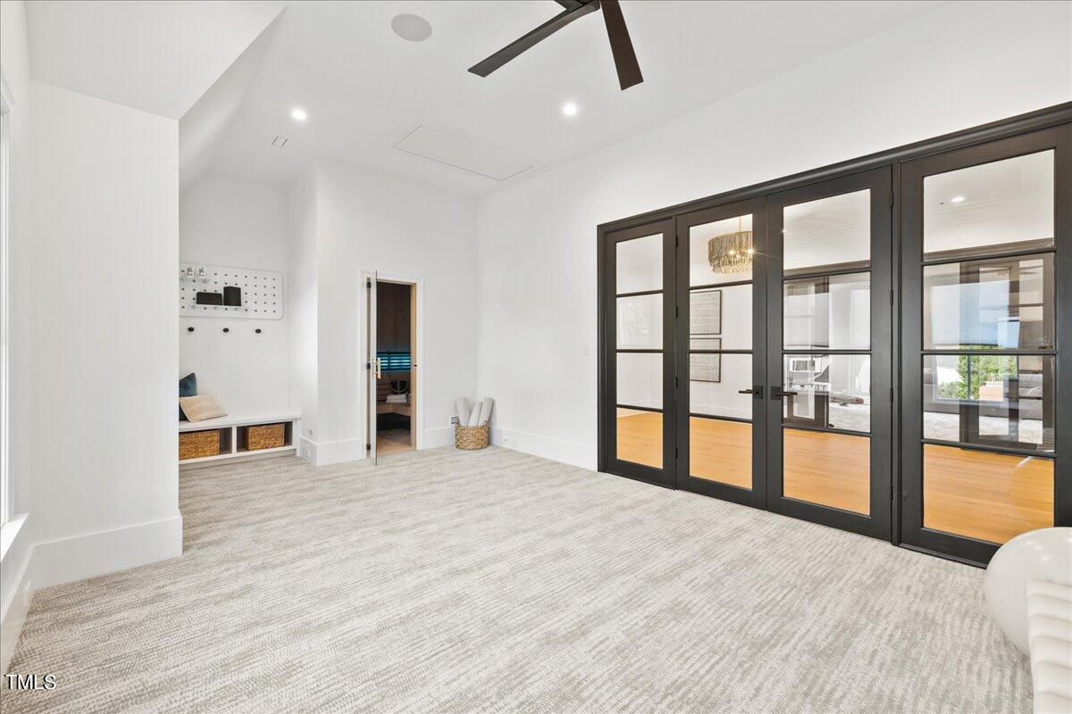 222 Reynolds Road Raleigh, NC 27609 - Photo 28 of 43 a view of an empty room with window and a kitchen